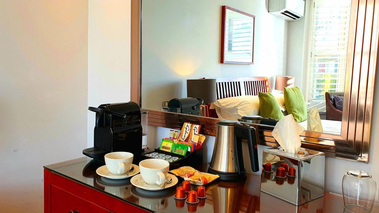 A Room With A View Brighton Dış mekan fotoğraf A Nespresso machine in a hotel room